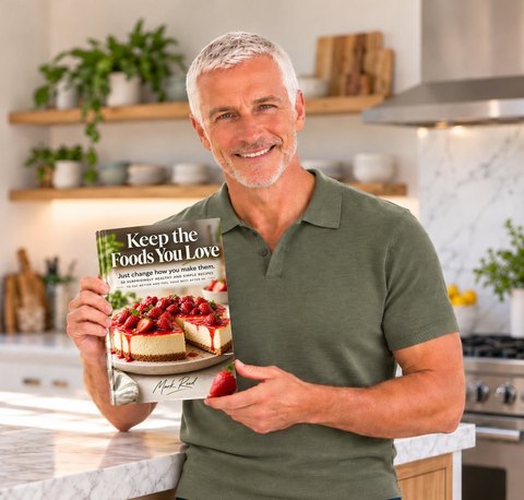 Mark Reed smiling in his kitchen.